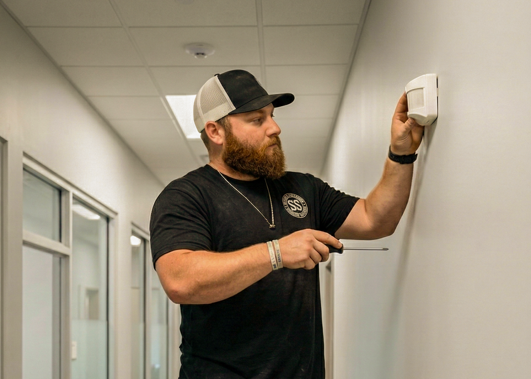 guy istalling Electronic Alarm & Detection Systems